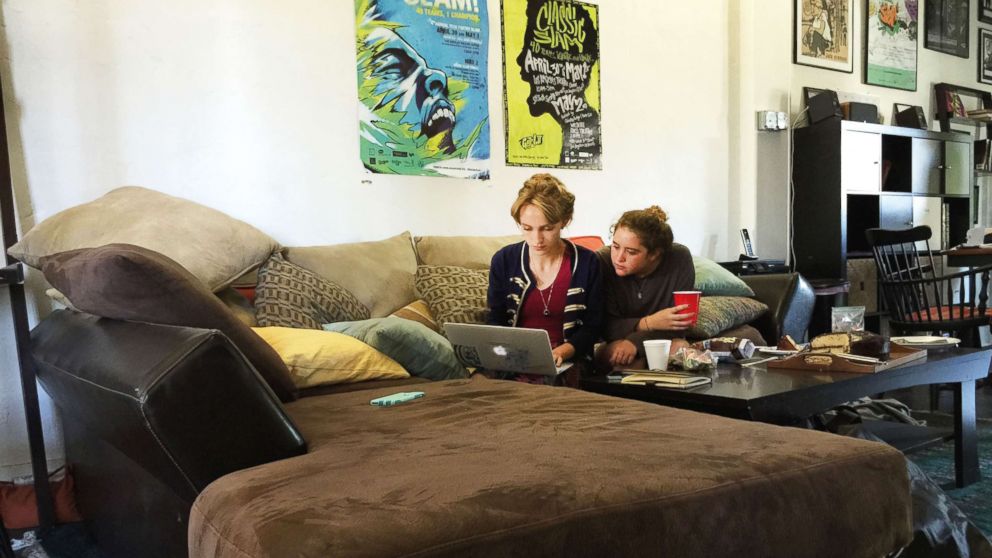 PHOTO: Rhiannon McGavin 17, and Miriam Sachs, members of Get Lit, polish a word poem during a Saturday working session. The time Get Lit poets were finalists in a competition, they third in the world.