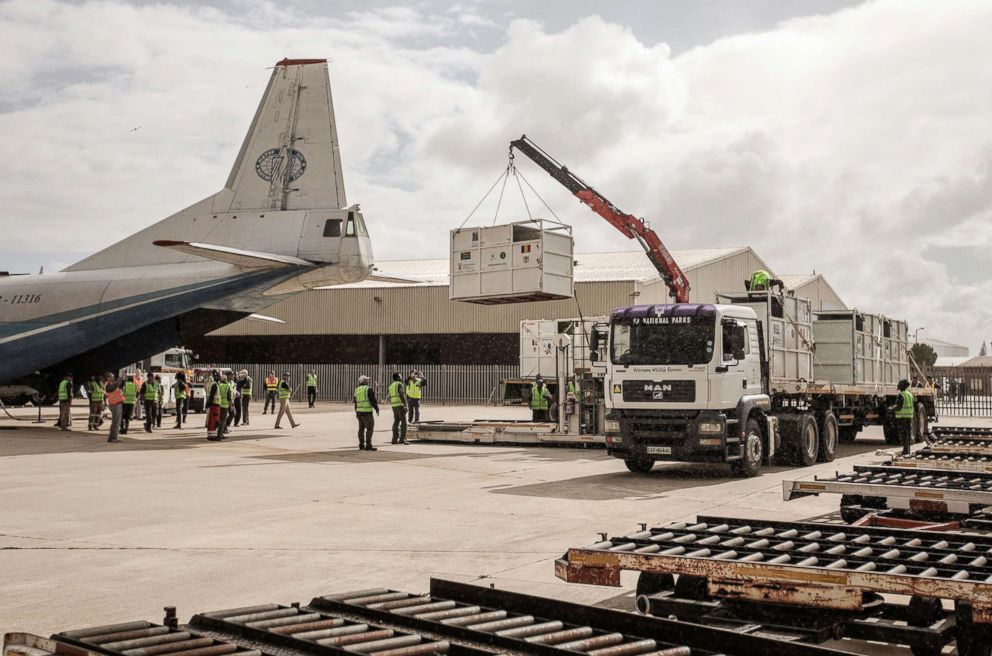 PHOTO: Veterinarians and airport cargo personnel load six rhinos into crates at South Africa's Addo Elephant National Park before airlifting them to Chad's Zakouma National Park, May 3, 2018.