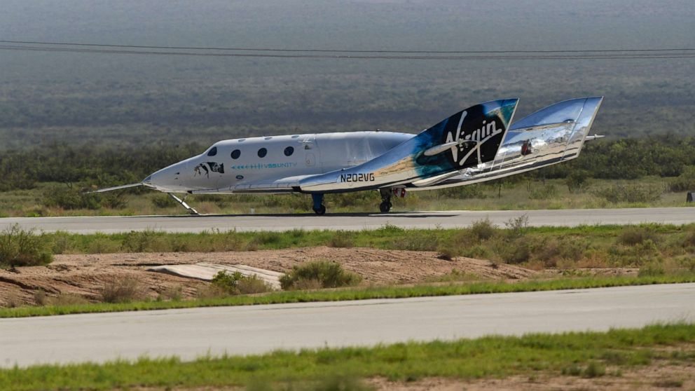 PHOTO: The Virgin Galactic SpaceShipTwo space plane Unity returns to earth after the mothership separated at Spaceport America, near Truth and Consequences, New Mexico on July 11, 2021.
