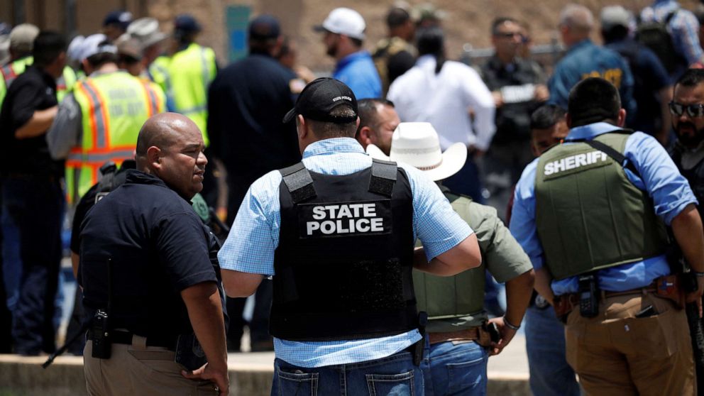 Law enforcement personnel guard the scene of a suspected shooting near Robb Elementary School in Uvalde, Texas, May 24, 2022