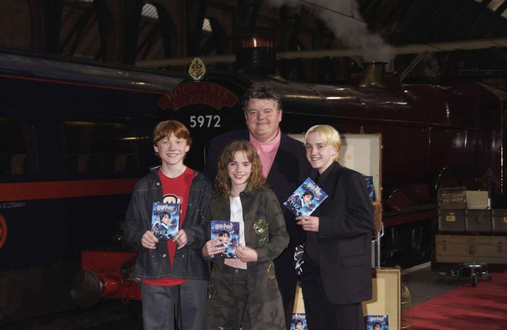 PHOTO: In this May 8, 2002, file photo, Robbie Coltrane, Rupert Grint, Emma Watson and Tom Felton appear at the 'Harry Potter and The Philosopher's Stone' DVD launch party held on platform 9 3/4, King's Cross Station in London.