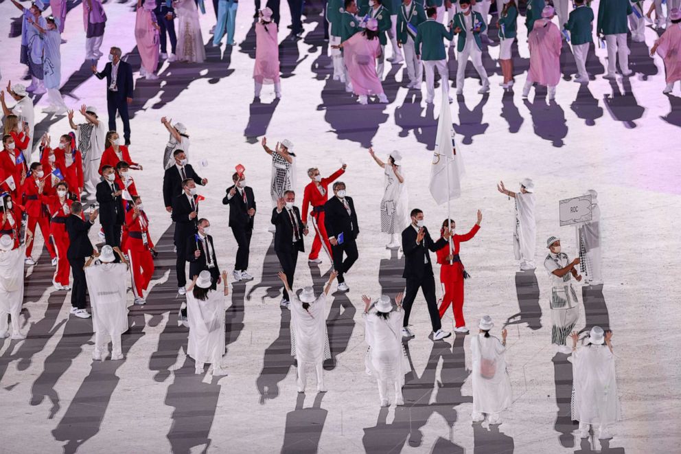 PHOTO: Flag bearers Sofya Velikaya and Maxim Mikhaylov of Team ROC lead their team during the Opening Ceremony of the Tokyo 2020 Olympic Games at Olympic Stadium on July 23, 2021 in Tokyo, Japan.