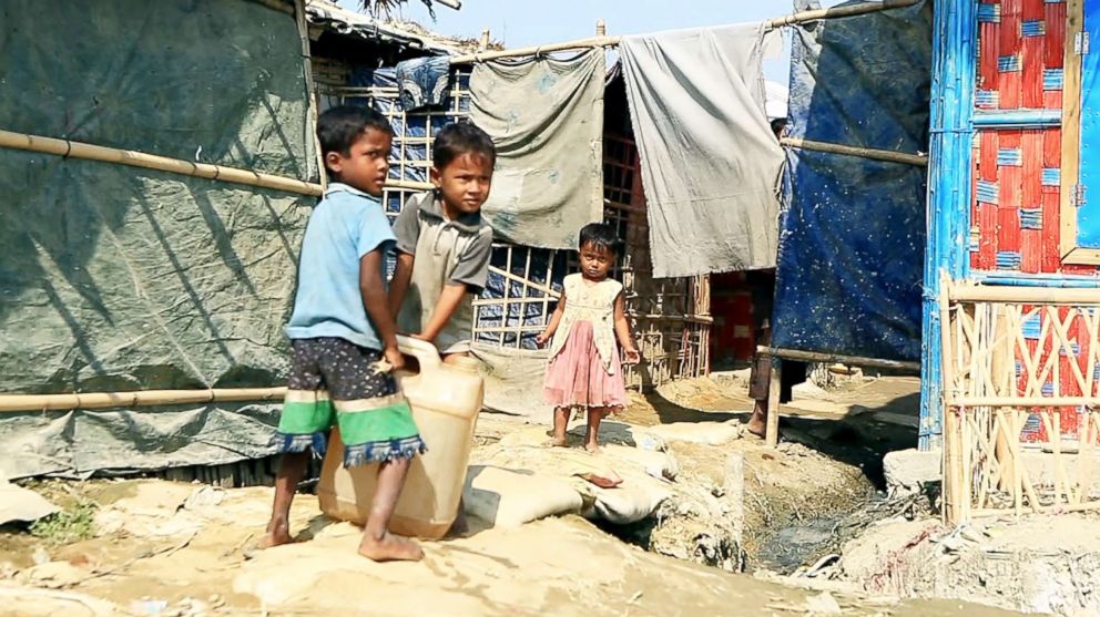 PHOTO: Children collect water at the Unchiprang refugee camp in Cox's Bazar, Bangladesh, Nov. 2018.