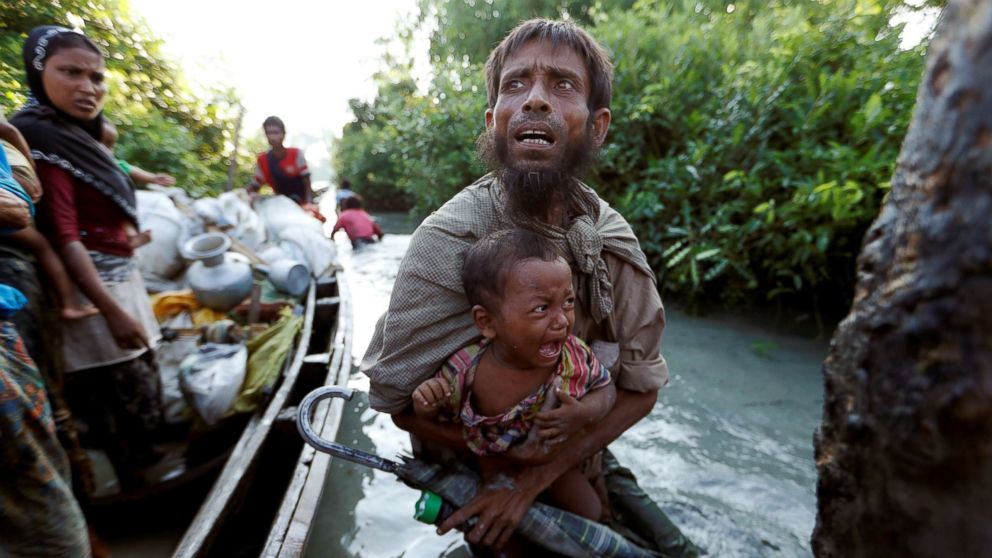 PHOTO: Rohingya refugees arrive to the Bangladeshi side of the Naf river after crossing the border from Myanmar, Oct. 16, 2017. 