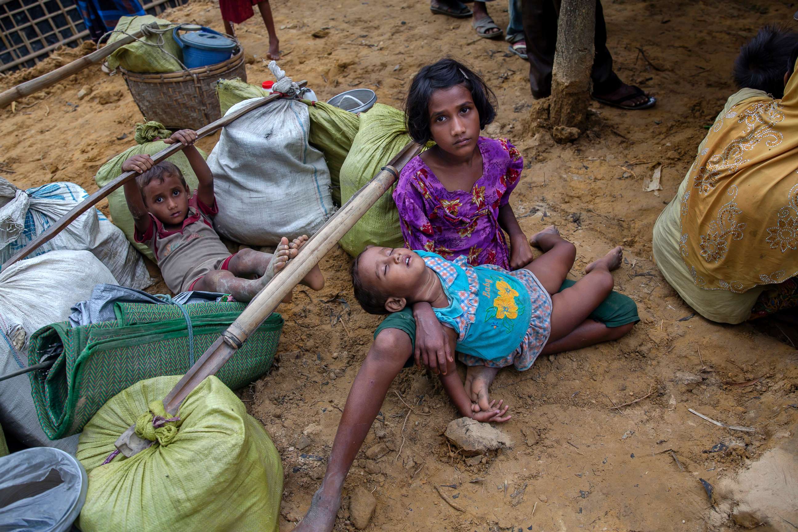 PHOTO: A Rohingya girl Shafiqa Begum, who spent four days in the open after crossing over from Myanmar into Bangladesh, holds her sister at Kutupalong refugee camp, Bangladesh, Oct. 19, 2017.