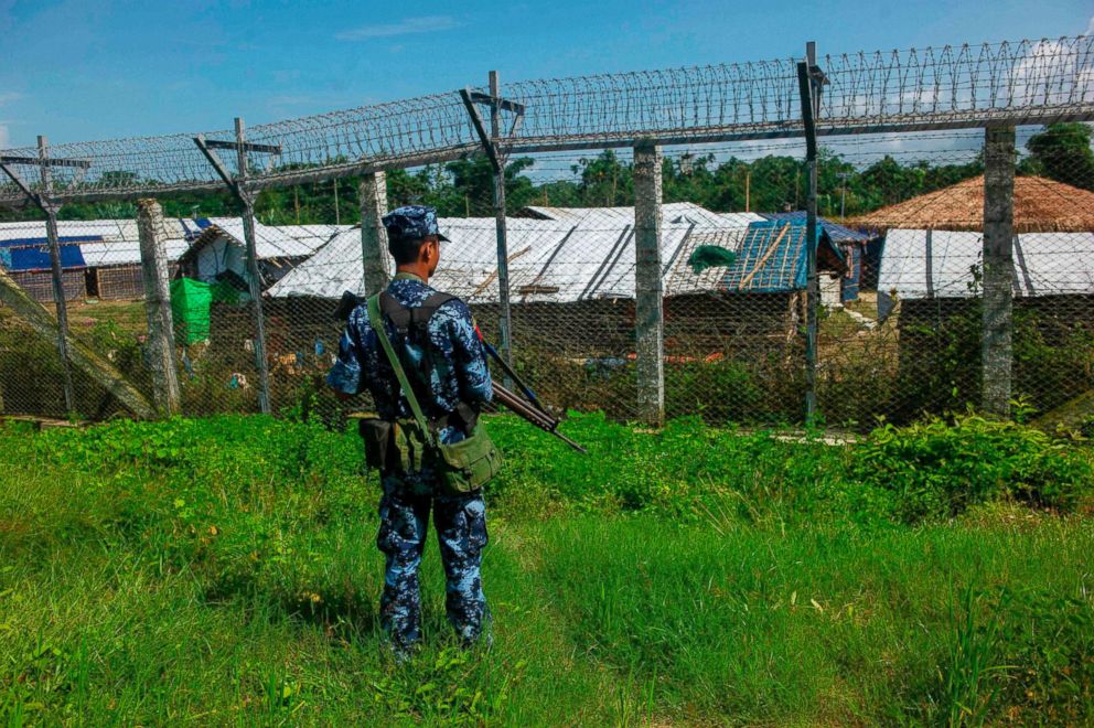 PHOTO: A Myanmar border guard policeman patrols along the border between Myanmar and Bangladesh in Maungdaw, Rakhine state, on June 29,  2018.