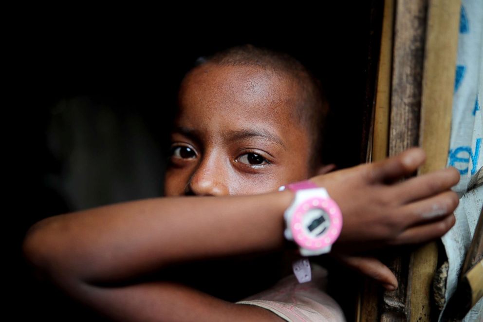 PHOTO: A Rohingya refugee child looks on in the Kutupalong camp in Cox's Bazar, Bangladesh August 24, 2018.