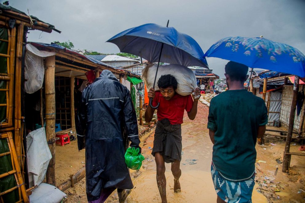 PHOTO: People walk inside the Kutupalong refugee camp in Coxs Bazar, Bangladesh on June 13, 2018.