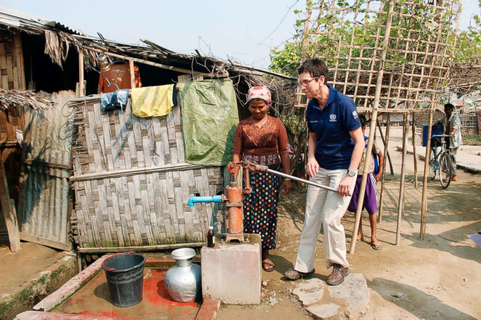 PHOTO: The United Nations Assistant Secretary-General for Humanitarian Affairs and Deputy Emergency Relief Coordinator Ursula Mueller (R) tries a hand water pump while meeting with members of the Muslim community in Sittwe, Rakhine State, April 4, 2018.