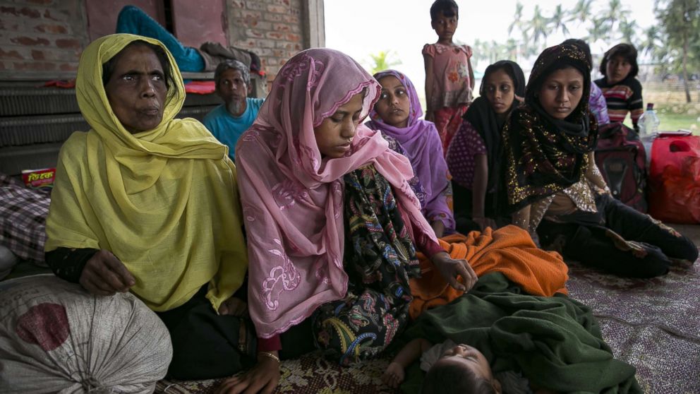 PHOTO: Recently arrived Rohingya refugees rest after crossing into Bangladesh, Nov. 24, 2017 in Cox's Bazar, Bangladesh.