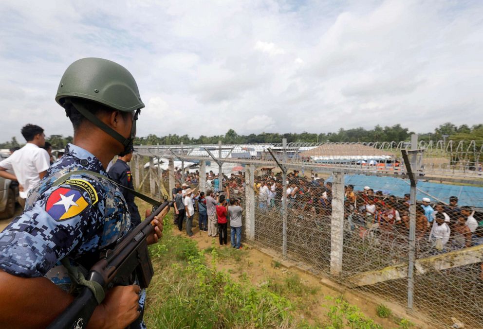 PHOTO: In this Aug. 24, 2018, file photo, a Myanmar border police officer stands guard near the fence of Rohingyas refugees makeshift houses at the 'no man's land' zone between the Bangladesh-Myanmar border in Rakhine State, western Myanmar.
