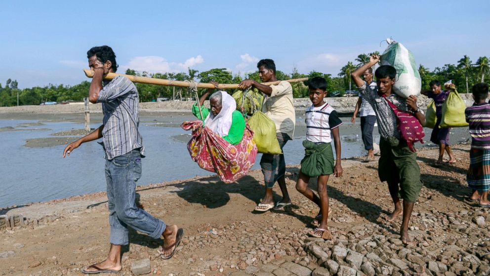 Newly arrived Rohingya refugees enter the mainland of Bangladesh through Sahporirdip, at Cox's Bazaar in Bangladesh, Oct. 25, 2018.