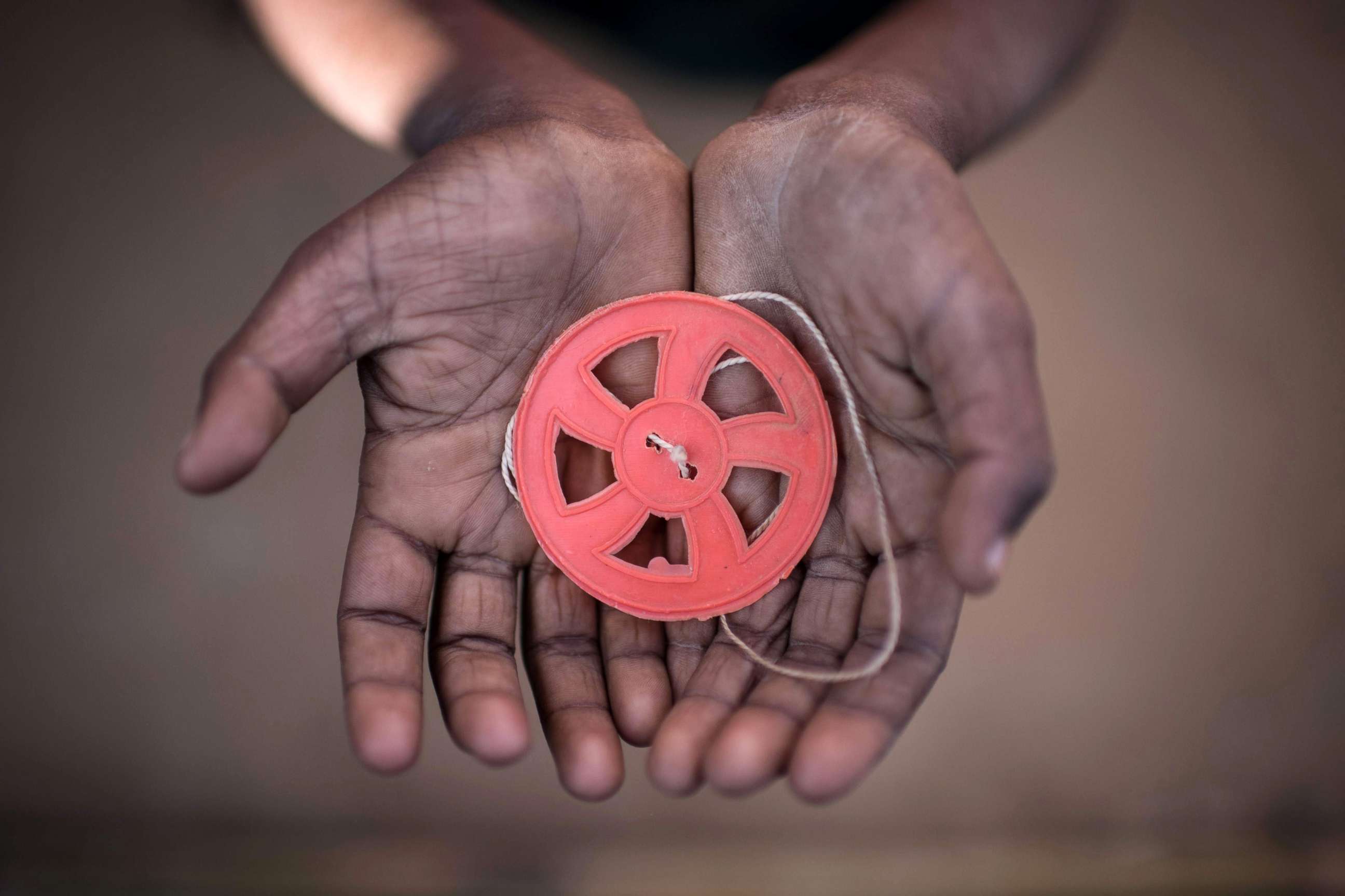 PHOTO: This photo taken on Nov. 29, 2017 shows a Rohingya migrant boy holding a spinning toy at the Kutupalong refugee camp in Cox's Bazar.