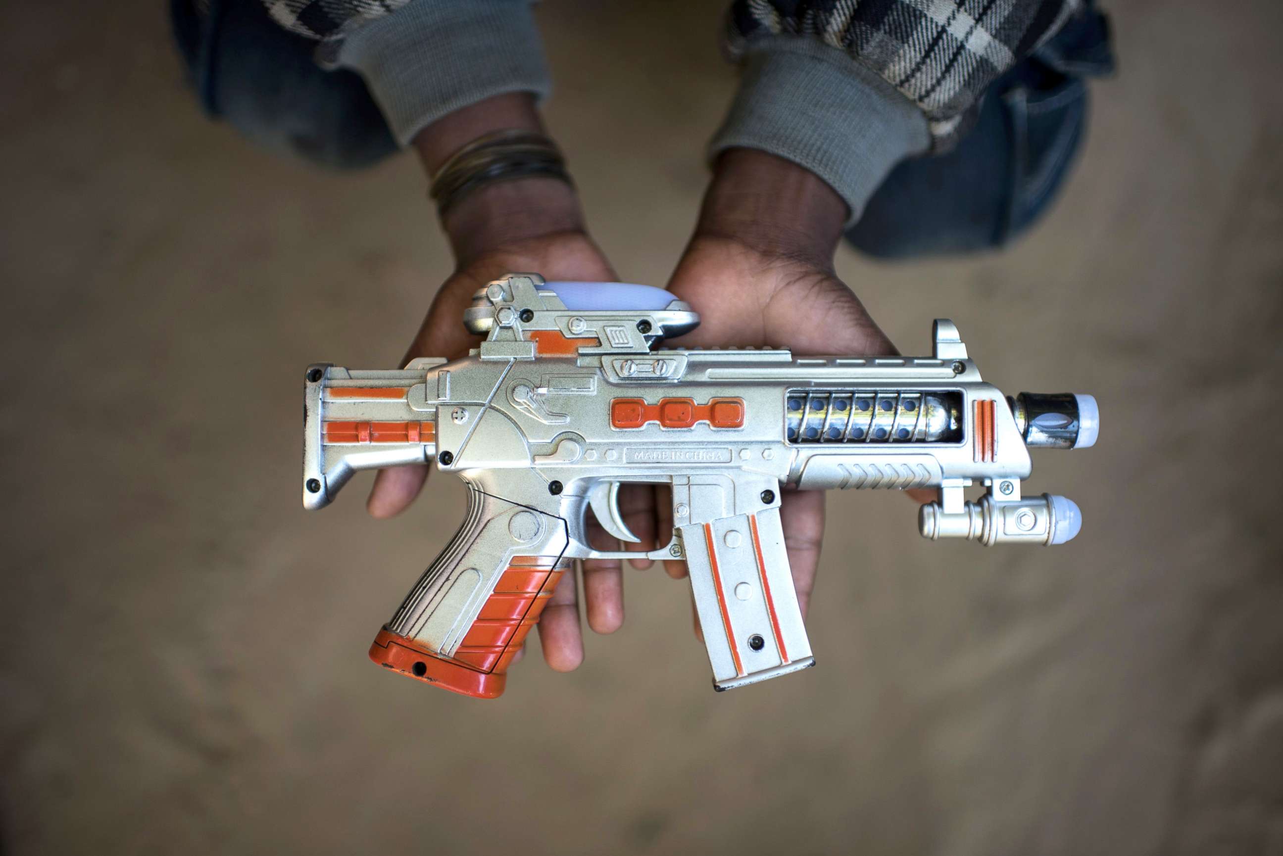 PHOTO: Rohingya migrant boy Saiful Islam (9), who fled Myanmar three years ago, holds a toy gun at the Shamlapur refugee camp in Cox's Bazar, Dec. 1, 2017.