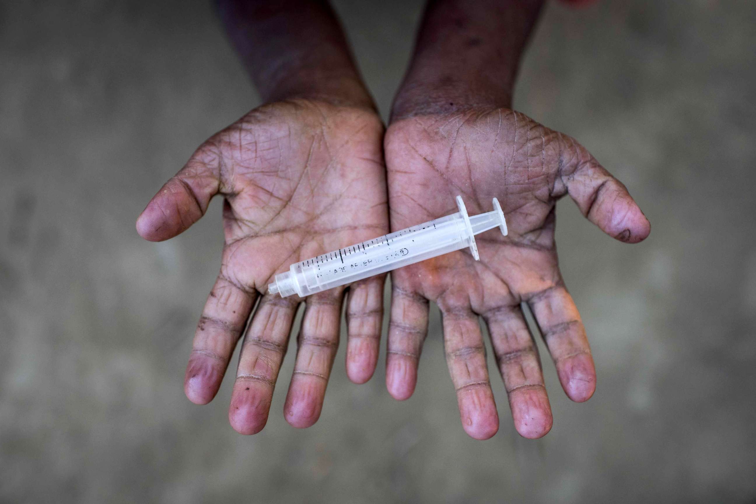 PHOTO: Rohingya migrant boy Mohhamad Hussein (10), who arrived in Bangladesh in October, holds a discarded syringe that he was playing with at the Thankhali refugee camp in Cox's Bazar, Dec. 2, 2017. 