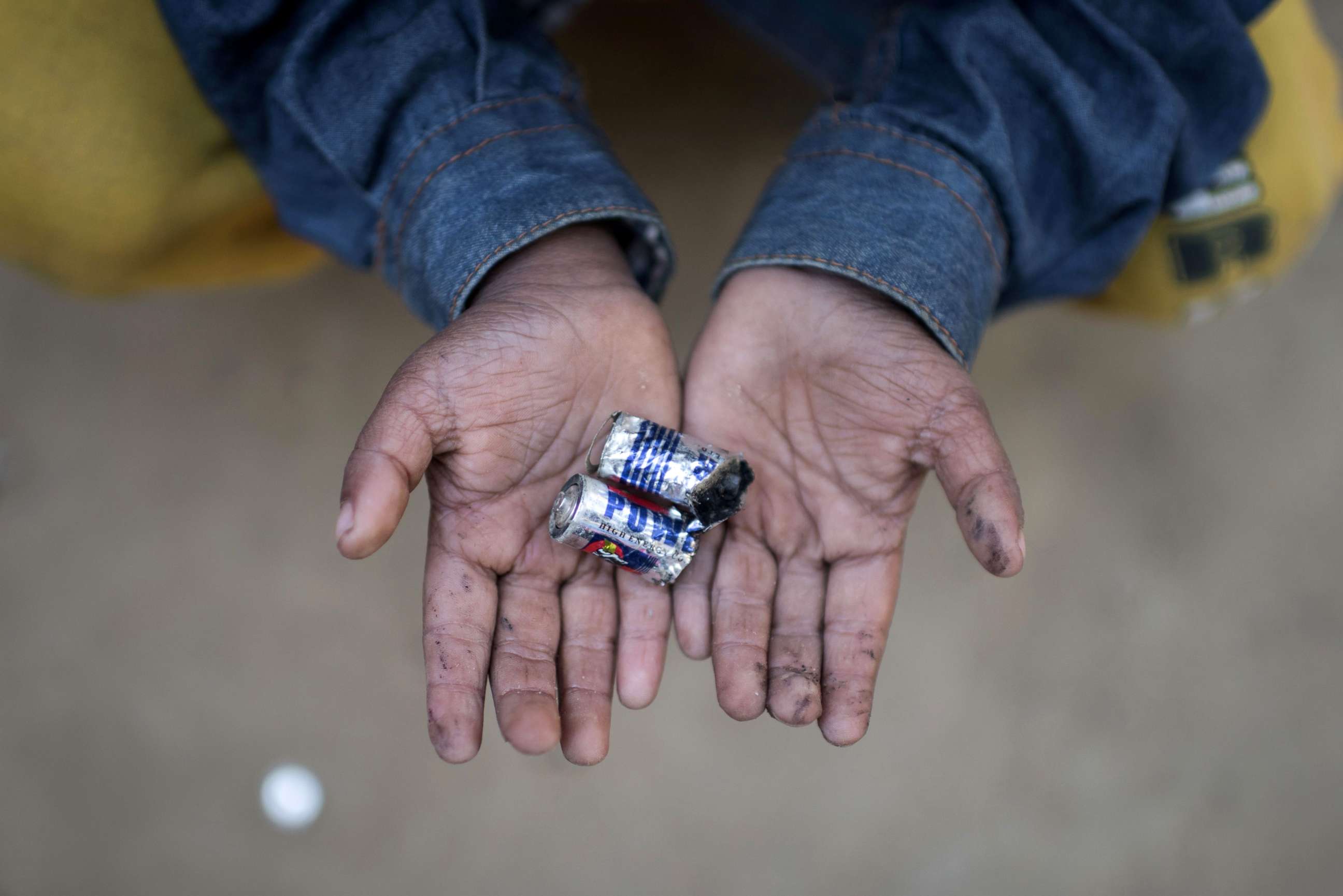 PHOTO: Rohingya migrant boy Mohammad Shahed (4) holds a battery that he was playing with by dismantling it at Thankhali refugee camp in Cox's Bazar, Dec. 2, 2017.