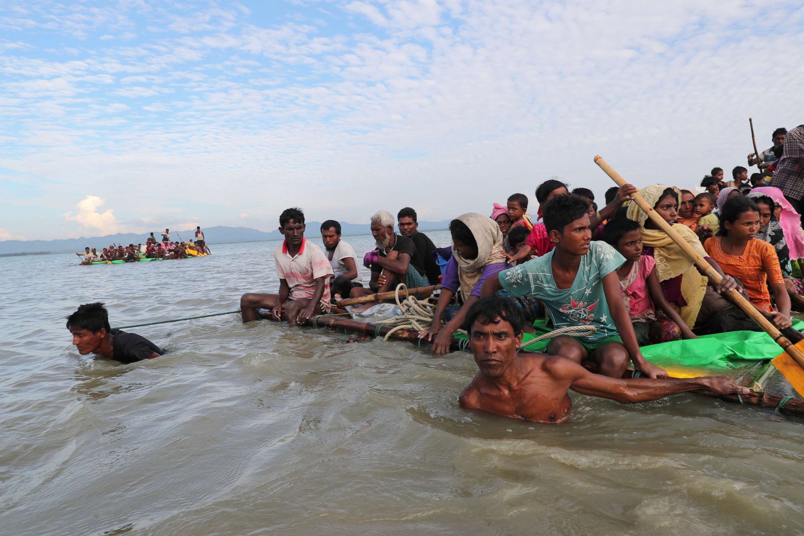 PHOTO: Rohingya refugees cross the Naf River with an improvised raft to reach to Bangladesh in Teknaf, Bangladesh, Nov. 12, 2017.