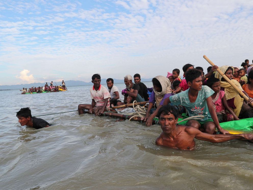 PHOTO: Rohingya refugees cross the Naf River with an improvised raft to reach to Bangladesh in Teknaf, Bangladesh, Nov. 12, 2017.