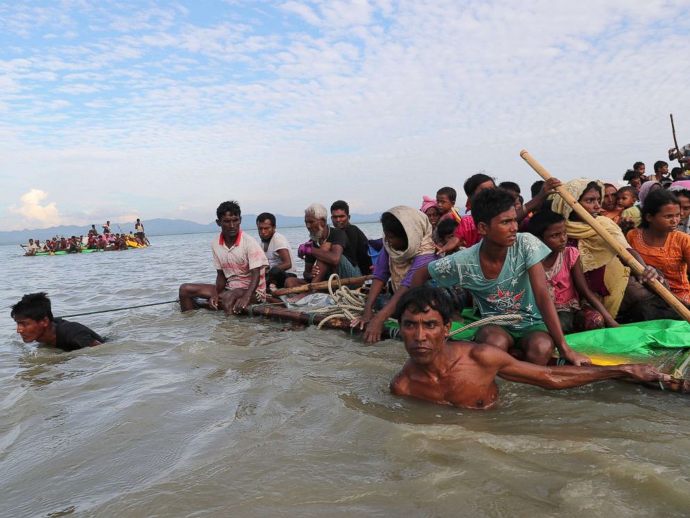 PHOTO: Rohingya refugees cross the Naf River with an improvised raft to reach to Bangladesh in Teknaf, Bangladesh, Nov. 12, 2017.