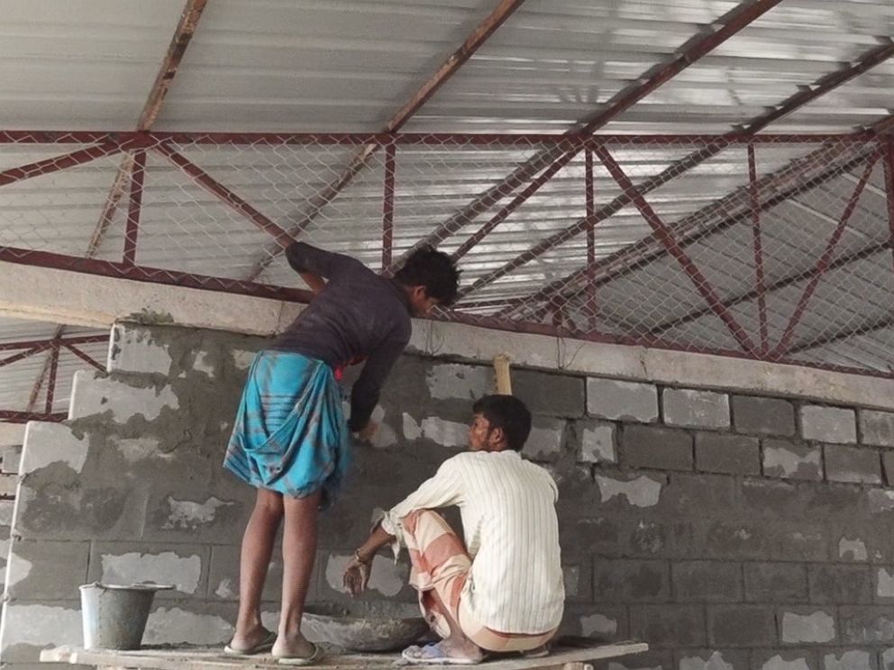 PHOTO: Men work on the housing development the Bangladesh government is building for thousands of Rohingya refugees.