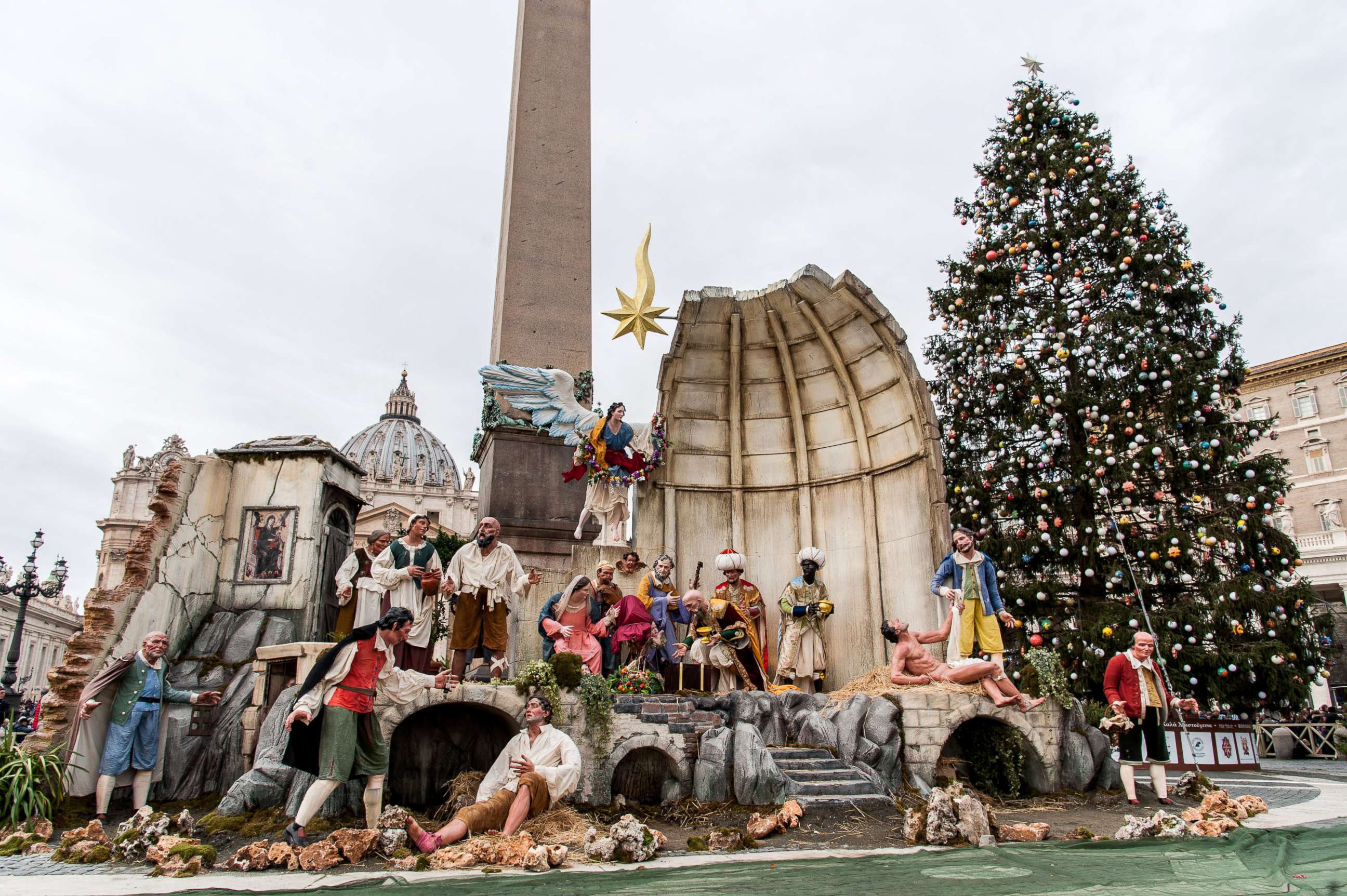 PHOTO: The 69 foot high Christmas tree coming from Poland and a nativity scene are back dropped by St. Peter's Basilica after being lit in St. Peter's Square at the Vatican, Dec. 10, 2017, in Rome. 