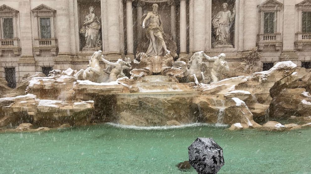 PHOTO: A man looks at the Trevi Fountain during a snowfall, in Rome, Feb. 26, 2018.