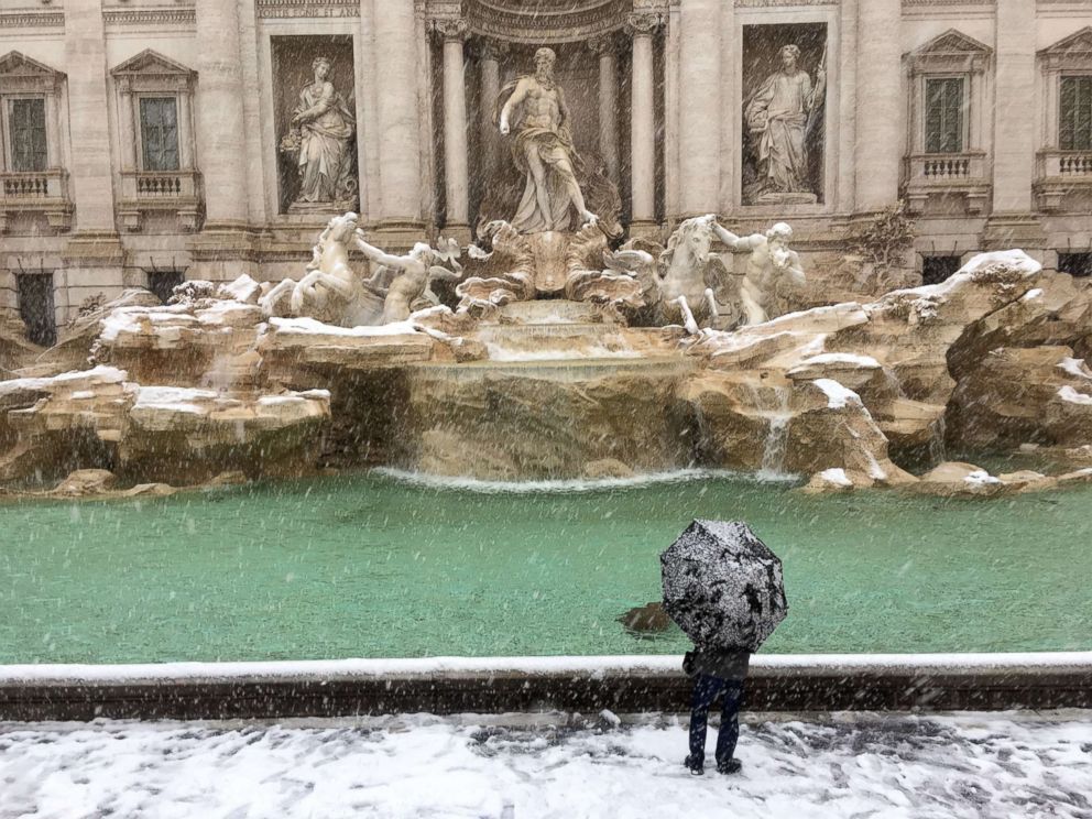 PHOTO: A man looks at the Trevi Fountain during a snowfall, in Rome, Feb. 26, 2018.