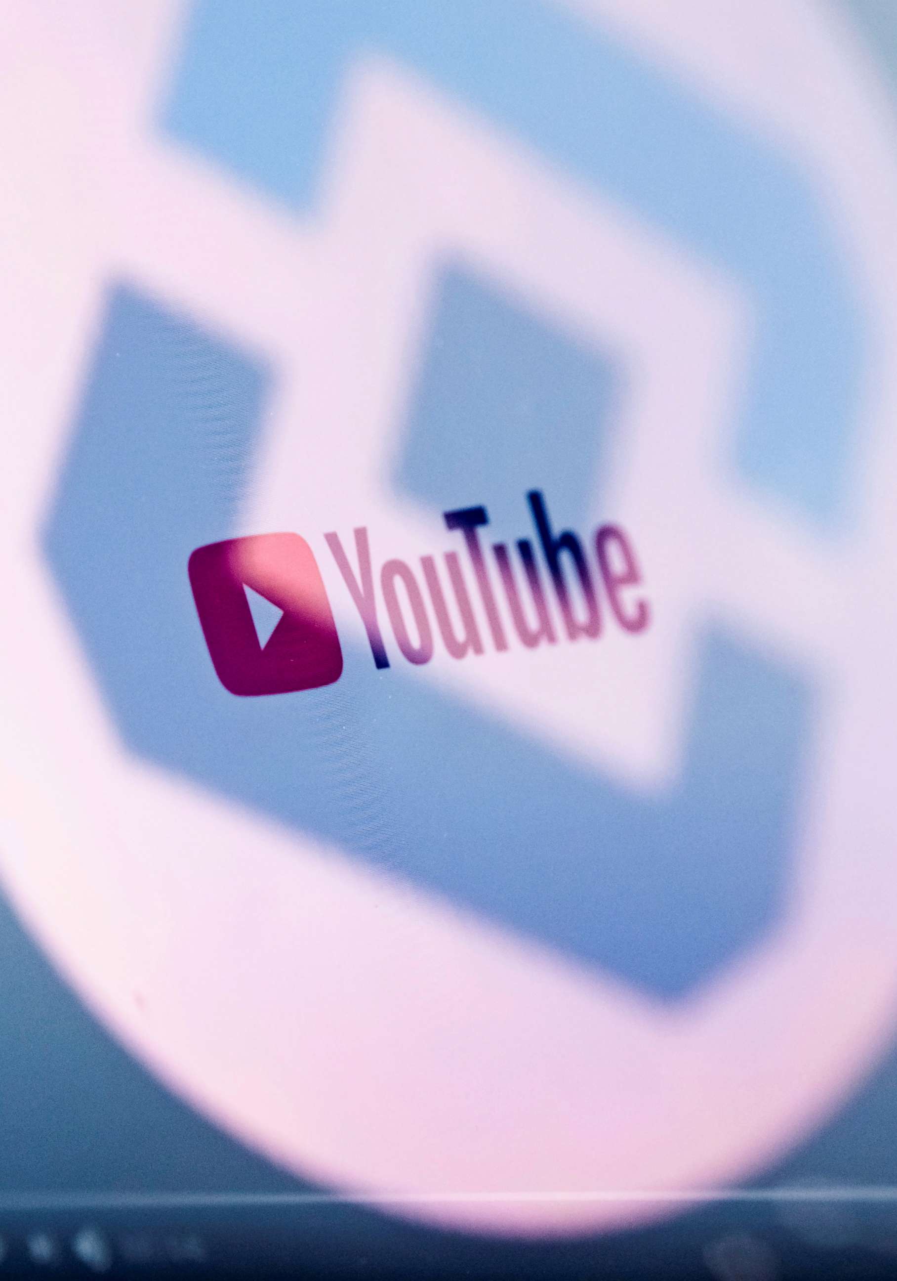 PHOTO: The logo of Russia's state communications regulator, Roskomnadzor, is reflected in a laptop screen showing a YouTube page, May 27, 2021.
