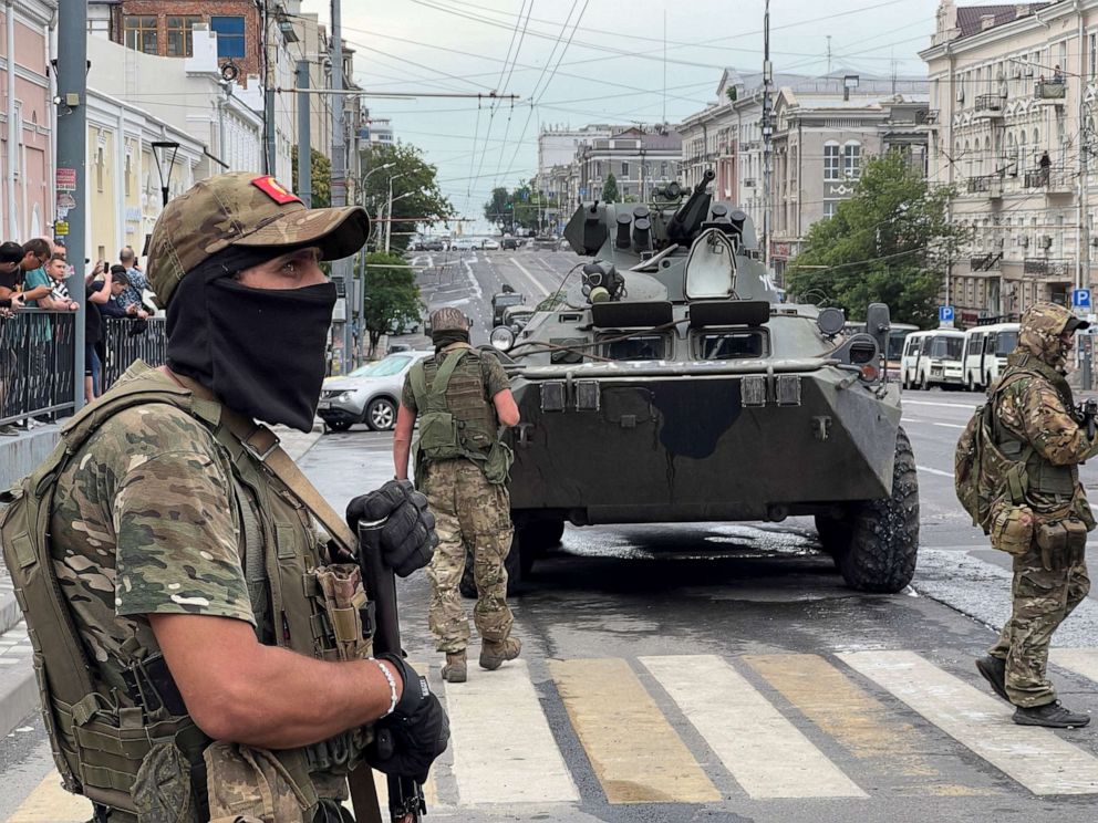 PHOTO: Fighters of Wagner private mercenary group stand guard in a street near the headquarters of the Southern Military District in the city of Rostov-on-Don, Russia, June 24, 2023.