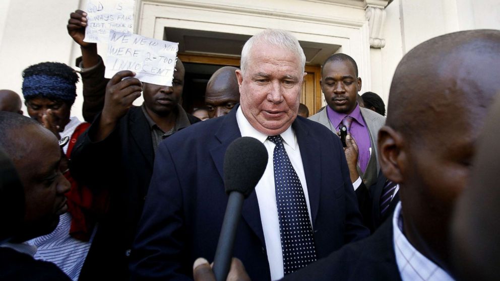 PHOTO: Zimbabwean Movement for Democratic Change (MDC) party treasurer Roy Bennett answers questions from journalists as he leaves the High Court of Zimbabwe in Harare, May 10, 2010.
