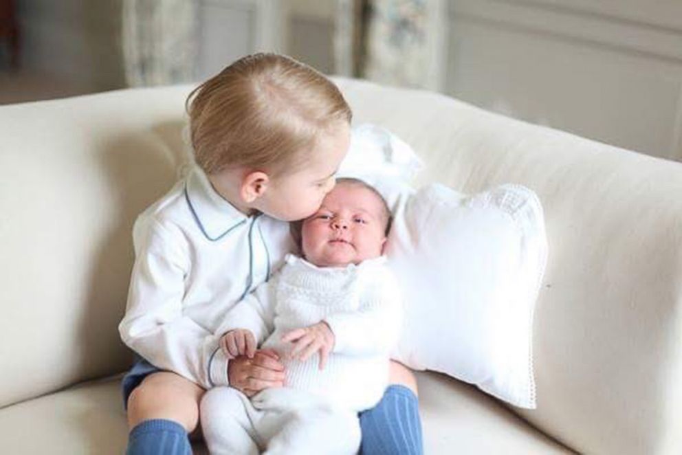 PHOTO: Prince George kissing the forehead of his sister, Princess Charlotte in a photograph released by Prince William and Princess Kate after Charlotte's  birth in 2015 at their Anmer Hall home. 