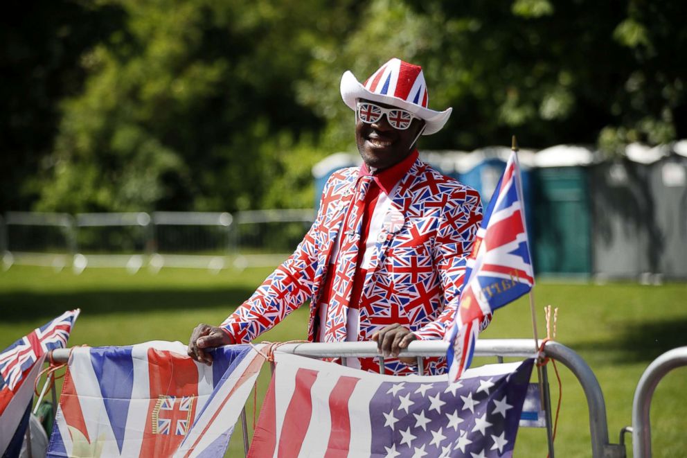 PHOTO: Royal fan Joseph Afrane, bedecked in a Union flag pattern, poses along the Long Walk in Windsor on May 18, 2018, the day before the Royal wedding.