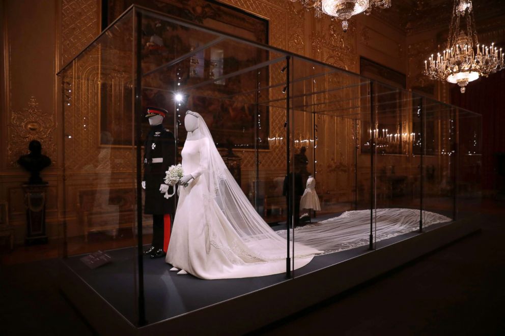 PHOTO: The wedding dress with a five-meter-long veil that Meghan the Duchess of Sussex wore and an identical uniform to the specially commissioned one Prince Harry wore at their May 19, 2018, wedding, are displayed in Windsor, England, Oct. 25, 2018.