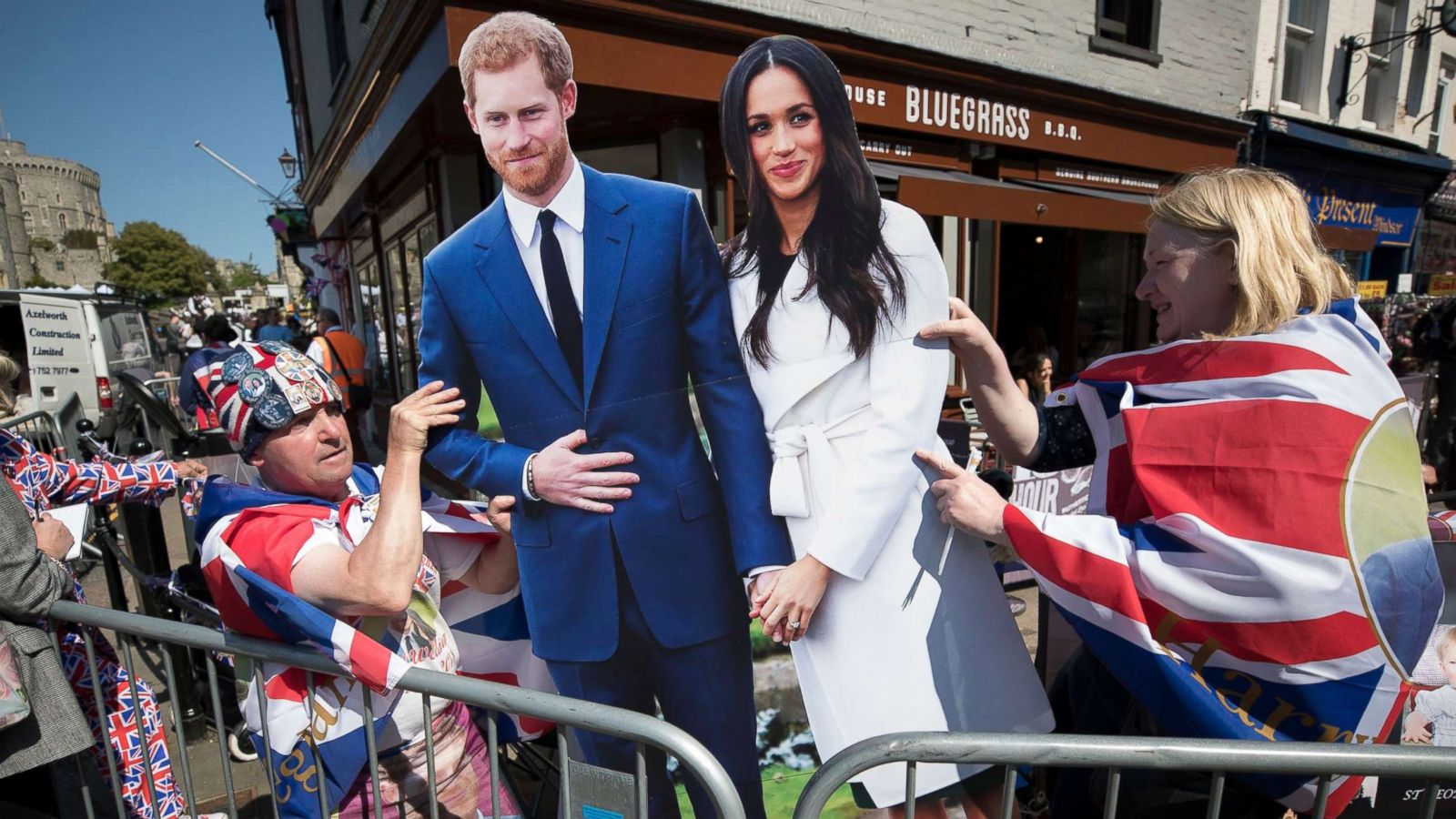 PHOTO: Royal fans, who are the first to camp out on the procession route in Windsor High Street on May 15, 2018, display a life size cardboard cut out of the royal couple ahead of the marriage of Prince Harry and Meghan Markle.