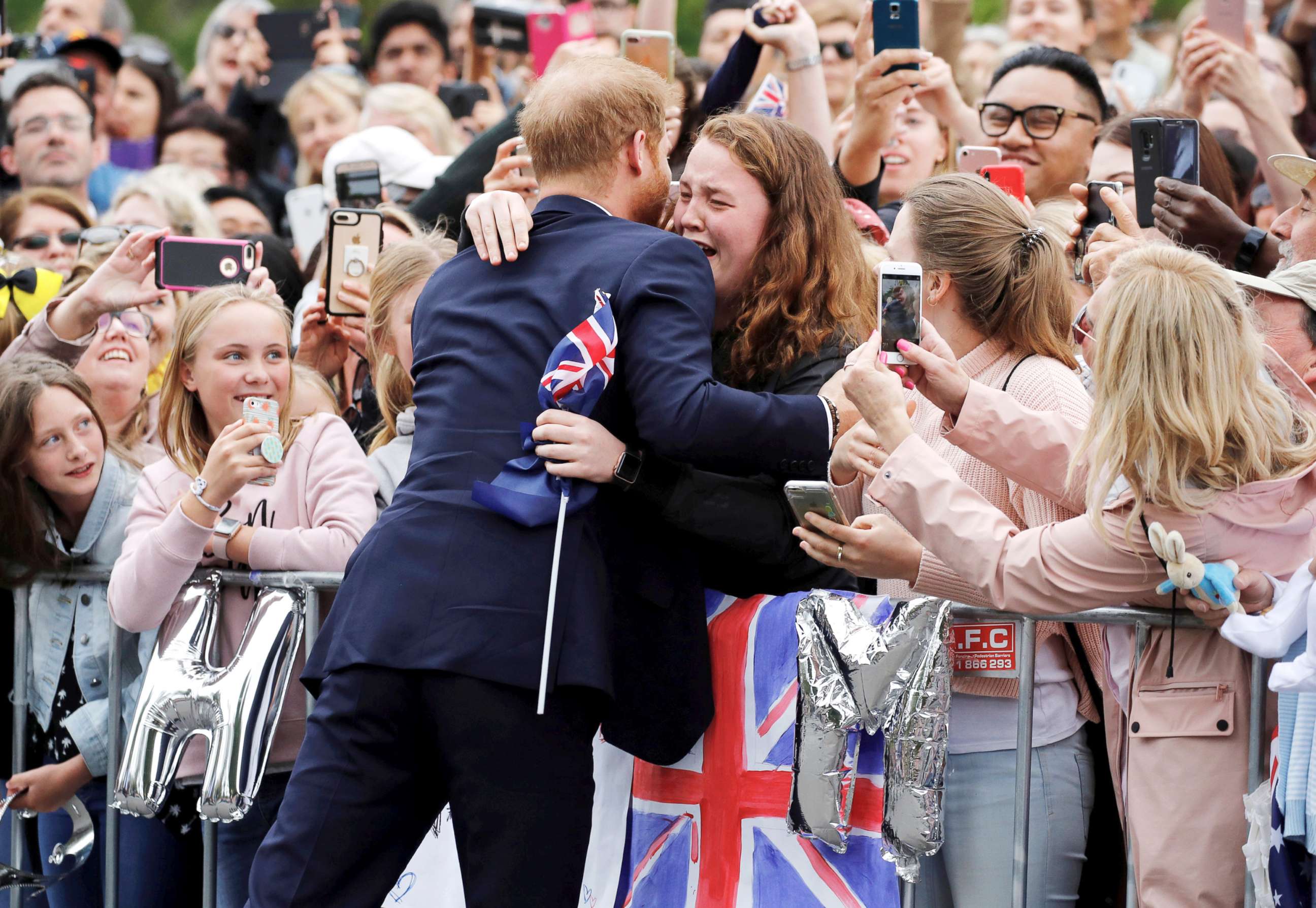 PHOTO: Britain's Prince Harry hugs a member of the public as he arrives at the Royal Botanic Gardens in Melbourne, Australia, Oct. 18, 2018.