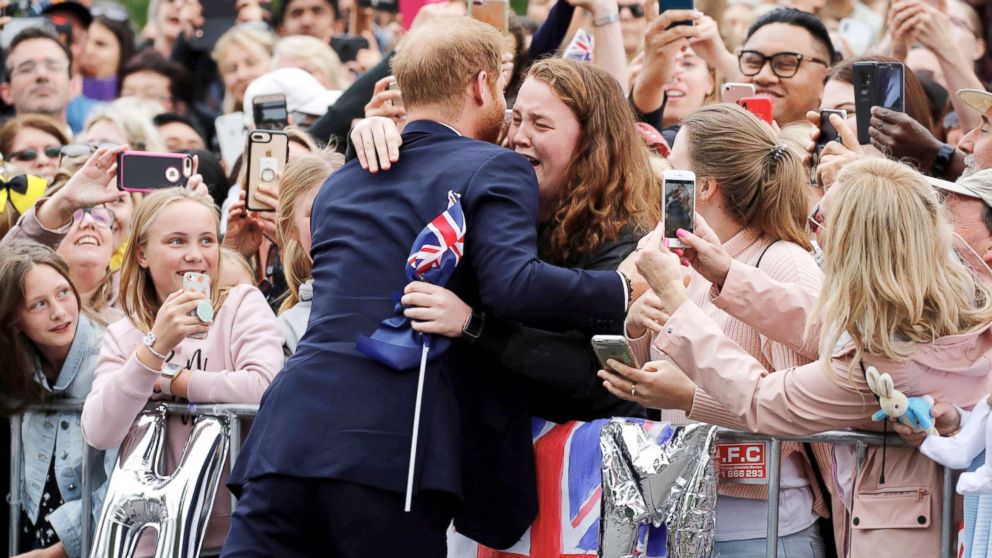 PHOTO: Britain's Prince Harry hugs a member of the public as he arrives at the Royal Botanic Gardens in Melbourne, Australia, Oct. 18, 2018.