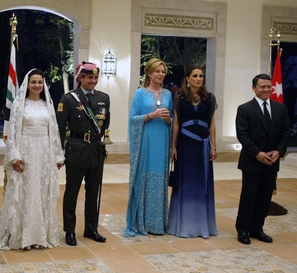 PHOTO: (R to L) Jordan's King Abdullah II, Queen Rania, Queen Noor, mother of the groom, Crown Prince Hamzeh and his bride Princess Noor attend the royal wedding on May 27, 2004 in Amman, Jordan.