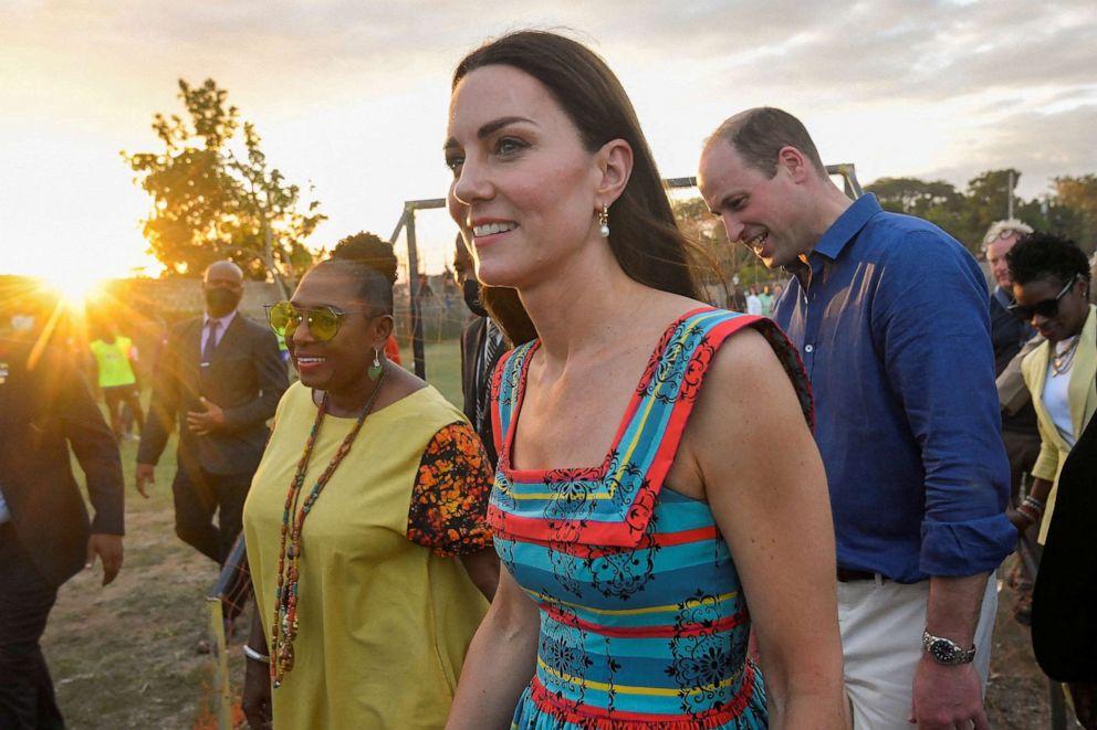 PHOTO: Britain's Prince William and Catherine, Duchess of Cambridge, walk during their visit to Trench Town on the fourth day of their tour of the Caribbean, in Kingston, Jamaica, March 22, 2022.