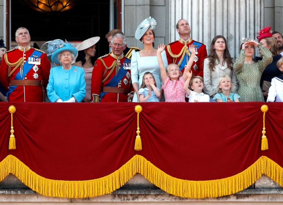 PHOTO: Britain's Queen Elizabeth and members of the British royal family, look up at the RAF flypast from the balcony of Buckingham Palace as part of Trooping the Color parade in central London, June 9, 2018.