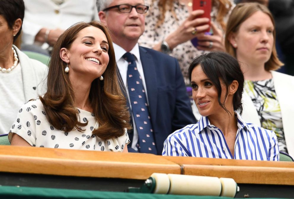 PHOTO: Catherine, Duchess of Cambridge and Meghan, Duchess of Sussex attend day twelve of the Wimbledon Lawn Tennis Championships at All England Lawn Tennis and Croquet Club on July 14, 2018 in London.