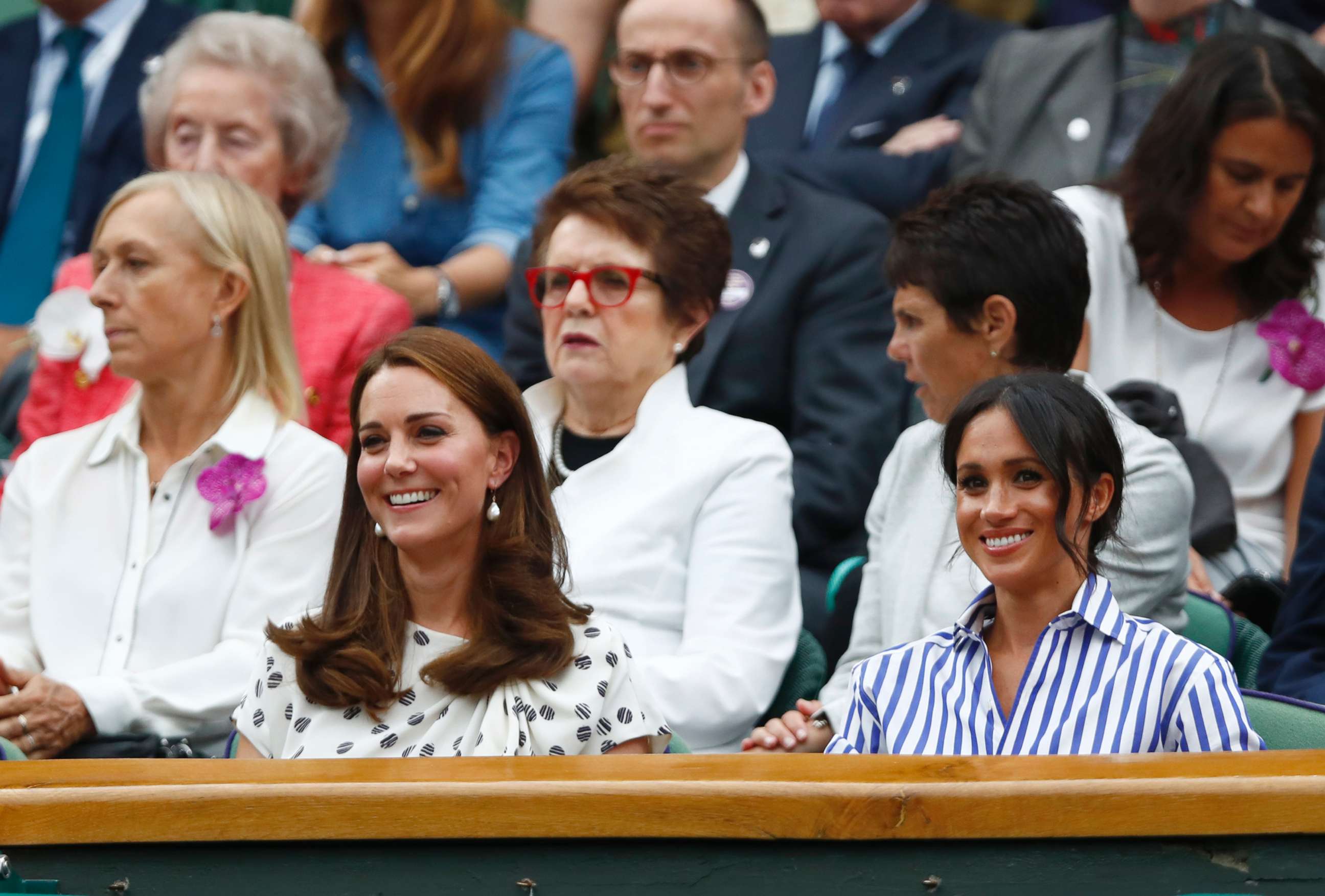 PHOTO: Catherine, Duchess of Cambridge and Meghan, Duchess of Sussex, right, sit in the Royal Box on Center Court at the Wimbledon Tennis Championships, in London, July 14, 2018.