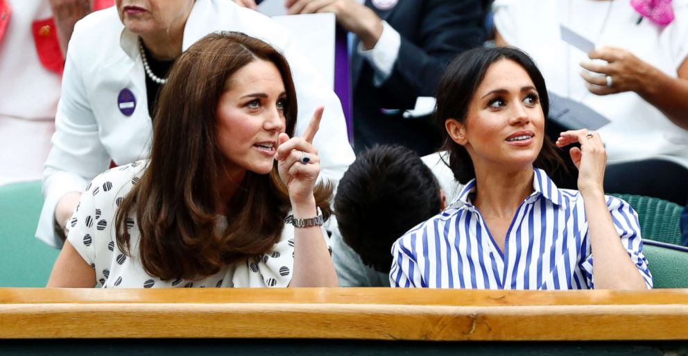 PHOTO: Catherine, Duchess of Cambridge and Meghan, Duchess of Sussex, right, sit in the Royal Box on Center Court at the Wimbledon Tennis Championships, in London, July 14, 2018.