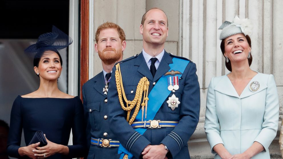 Meghan, Duchess of Sussex, Prince Harry, Duke of Sussex, Prince William, Duke of Cambridge and Catherine, Duchess of Cambridge watch a flypast to mark the centenary of the Royal Air Force from the balcony of Buckingham Palace, July 10, 2018, in London. 