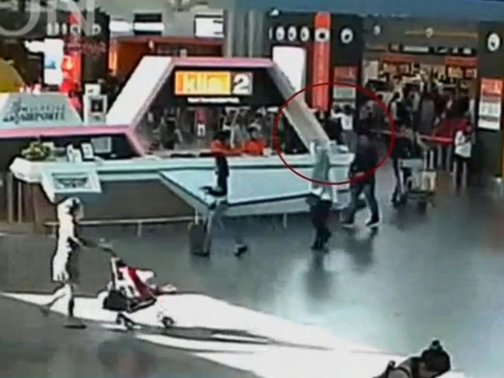 PHOTO: A still image from a CCTV footage appears to show (circled in red) Kim Jong Nam being accosted by a woman in a white shirt at Kuala Lumpur International Airport in Malaysia, Feb. 13, 2017.