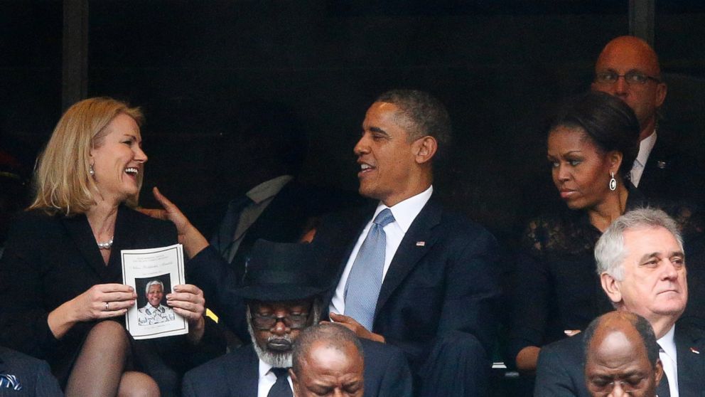 PHOTO: U.S. President Barack Obama shares a moment with Denmark's Prime Minister Helle Thorning-Schmidt , left, as first lady Michelle Obama looks on