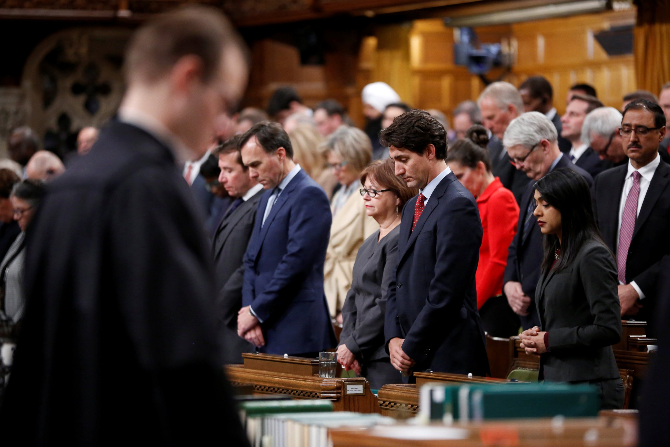PHOTO: Canada's Prime Minister Justin Trudeau joins fellow MPs in a moment of silence after delivering a statement on a deadly shooting at a Quebec City mosque, in the House of Commons on Parliament Hill in Ottawa, Ontario, Canada, Jan. 30, 2017.