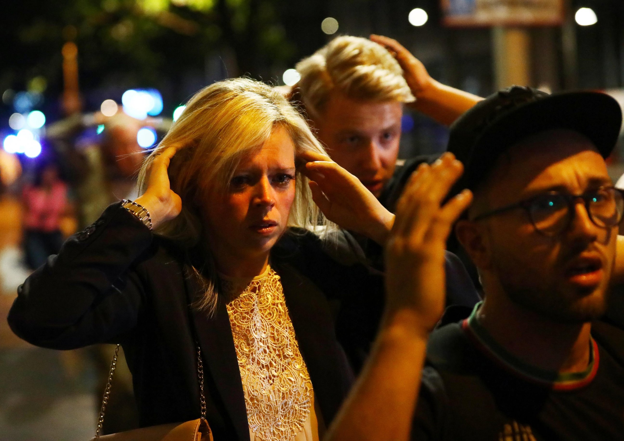 PHOTO: People leave the area with their hands up after an incident near London Bridge in London, Britain June 4, 2017.