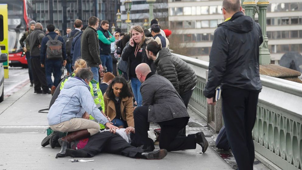 PHOTO: Injured people are assisted after an incident on Westminster Bridge in London, March 22, 2017.