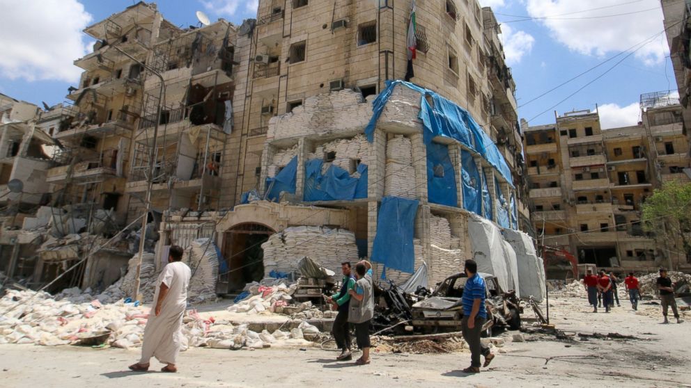 PHOTO: People inspect the damage at al-Quds hospital after it was hit by airstrikes, in a rebel-held area of Syria's Aleppo, April 28, 2016.