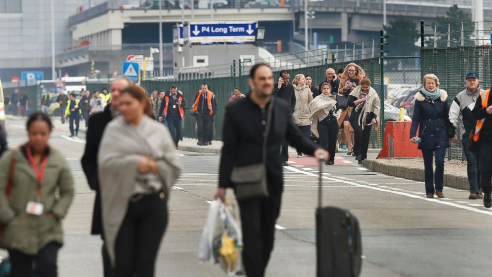 PHOTO: People leave the scene of explosions at Zaventem airport near Brussels, Belgium, March 22, 2016.